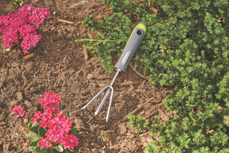 Handheld cultivator from Canadian Tire for lawn aeration