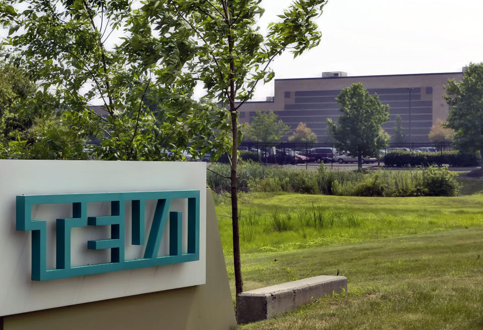 FILE - In this July 25, 2005 file photo, the offices of Teva Pharmaceuticals North America are seen in Horsham, Pa. At least a half-dozen companies that make or distribute prescription opioid painkillers are facing a federal criminal investigation of their roles in a nationwide addiction and overdose crisis. The Wall Street Journal first reported the investigation Tuesday, Nov. 26, 2019, citing unnamed sources familiar with the probe. (AP Photo/George Widman, File)