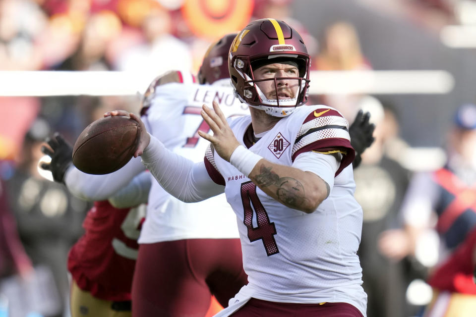 FILE - Washington Commanders quarterback Taylor Heinicke throws to a receiver in the first half of an NFL football game against the San Francisco 49ers, Saturday, Dec. 24, 2022, in Santa Clara, Calif. Setting up a competition at quarterback, the Atlanta Falcons have agreed to terms with Taylor Heinicke on a two-year contract worth up to $20 million, a person with knowledge of the deal told The Associated Press, Tuesday, March 14, 2023. (AP Photo/Godofredo A. Vásquez, File)