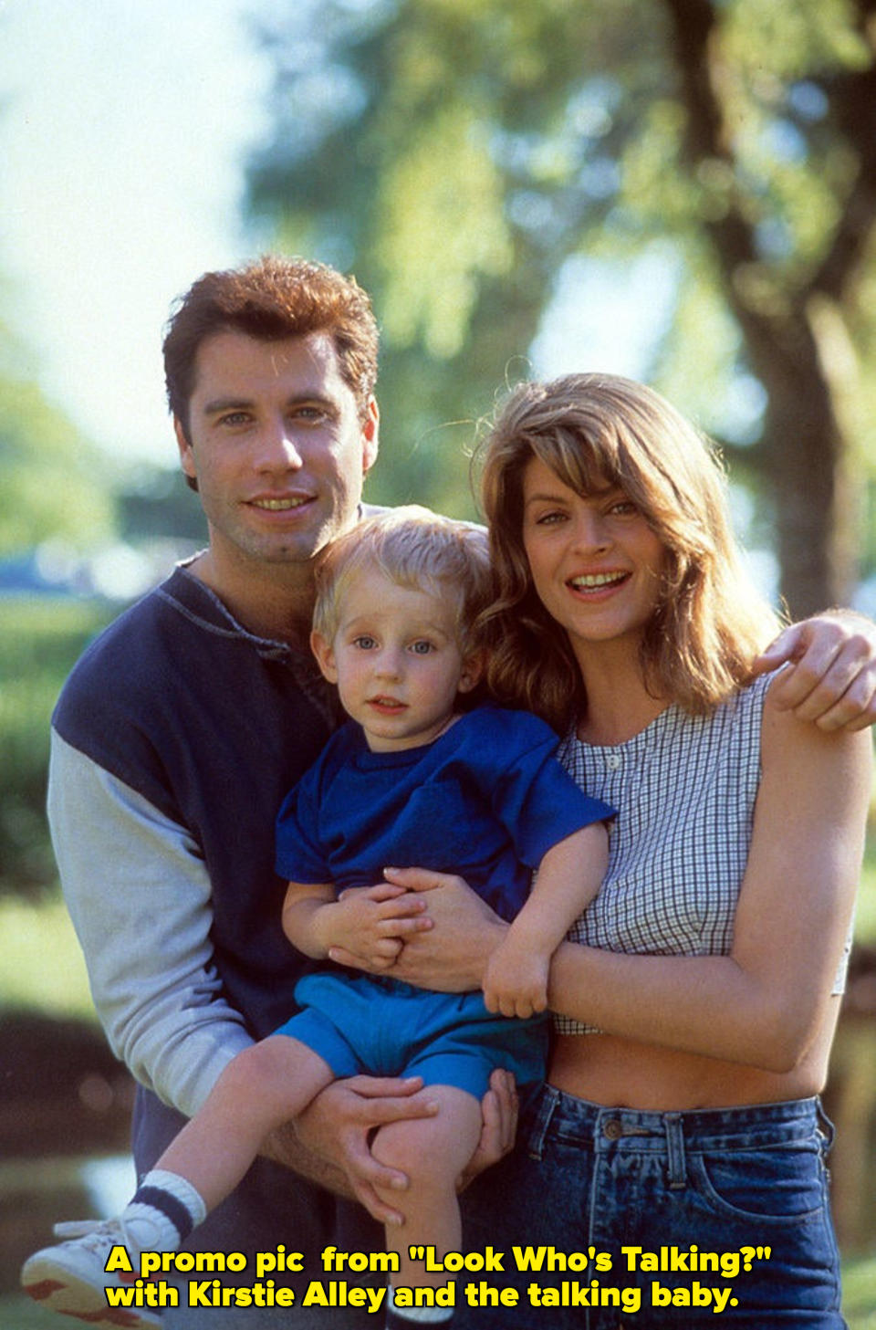 Travolta and Kirstie Alley hold a baby together and smile