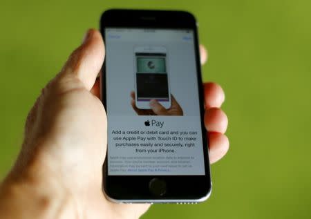 An Apple iphone 6 with Apple Pay is shown in this photo illustration in Encinitas , California June 3, 2015. REUTERS/Mike Blake