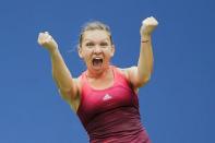 Simona Halep of Romania celebrates her victory over Victoria Azarenka of Belarus during their quarterfinals match at the U.S. Open Championships tennis tournament in New York, September 9, 2015. REUTERS/Eduardo Munoz