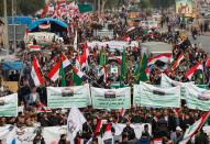 Iraqi demonstrators gather during ongoing anti-government protests in Baghdad