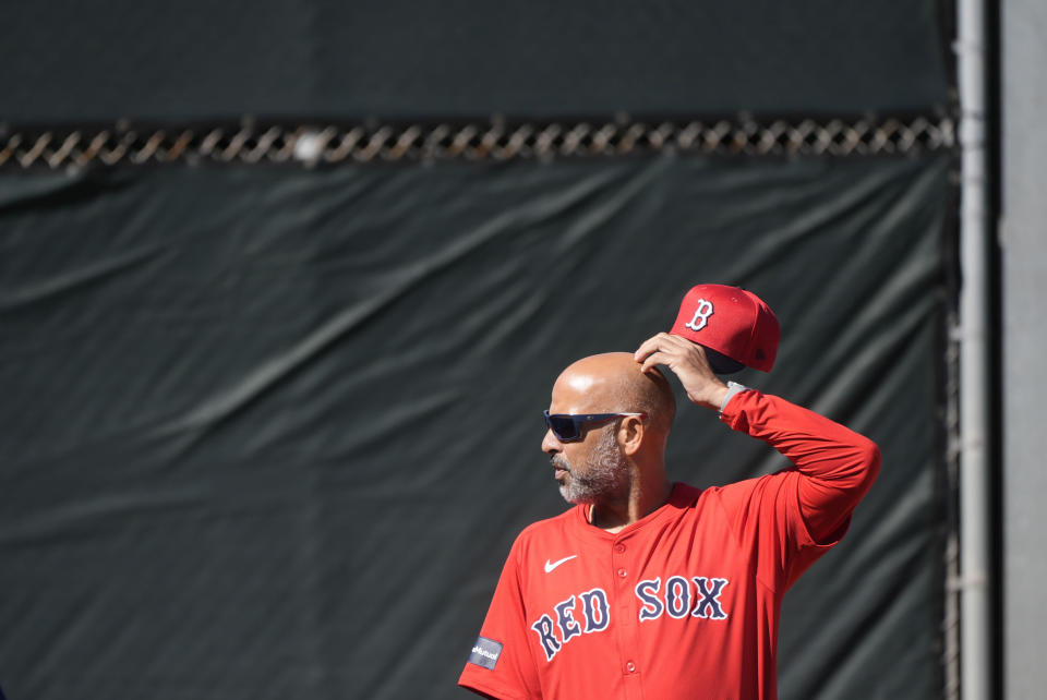 Red Sox manager Alex Cora watches workouts during spring training in Fort Myers, Fla., Thursday, Feb. 15, 2024. (AP Photo/Gerald Herbert)