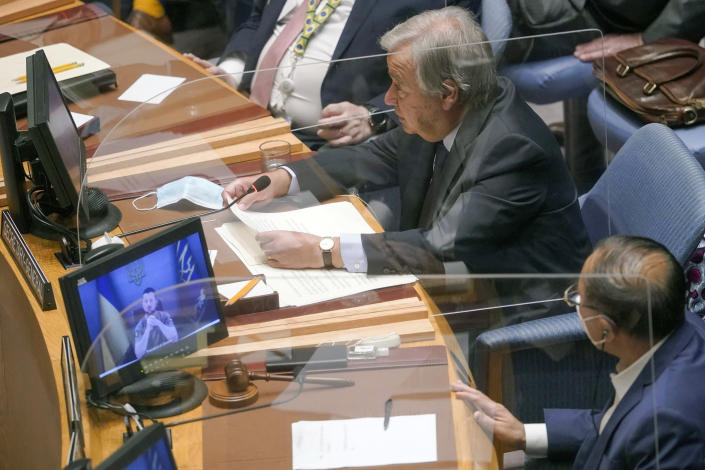 Ukrainian President Volodymyr Zelenskyy appears on a video screen as United Nations Secretary-General Antonio Guterres speaks during a Security Council meeting on threats to international peace and security, Wednesday, Aug. 24, 2022, at United Nations headquarters. (AP Photo/Mary Altaffer)