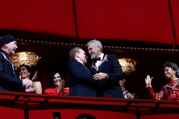 PHOTO: Honorees Bono and George Clooney greet each other beside The Edge and Tania Leon at the 45th Kennedy Center Honors ceremony, Dec. 4, 2022. in Washington. (Paul Morigi/Getty Images)