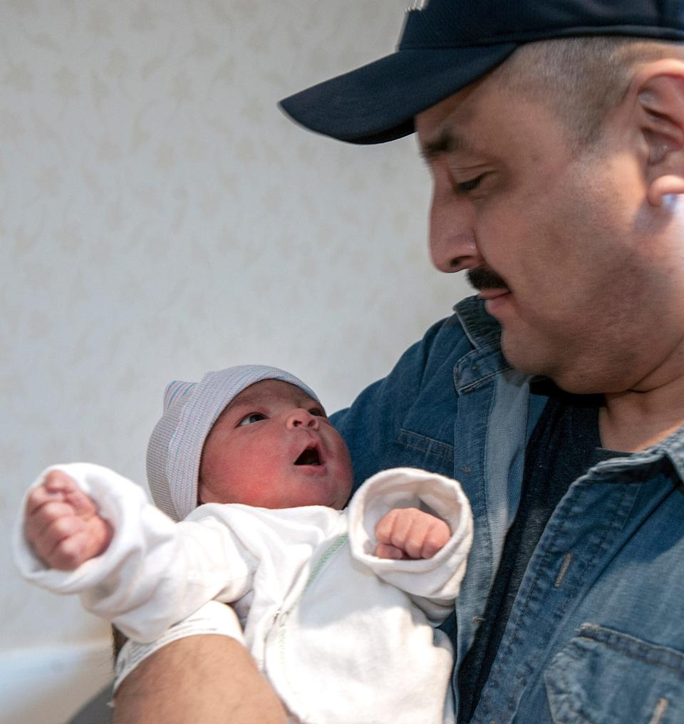 Erick Garcia, of Marlborough, holds his new daughter, Erelin Darianna, on Tuesday, a day after she became MetroWest's first baby born in 2024. Erelin weighed in at 7 pounds 13 ounces and measured 21 inches long.