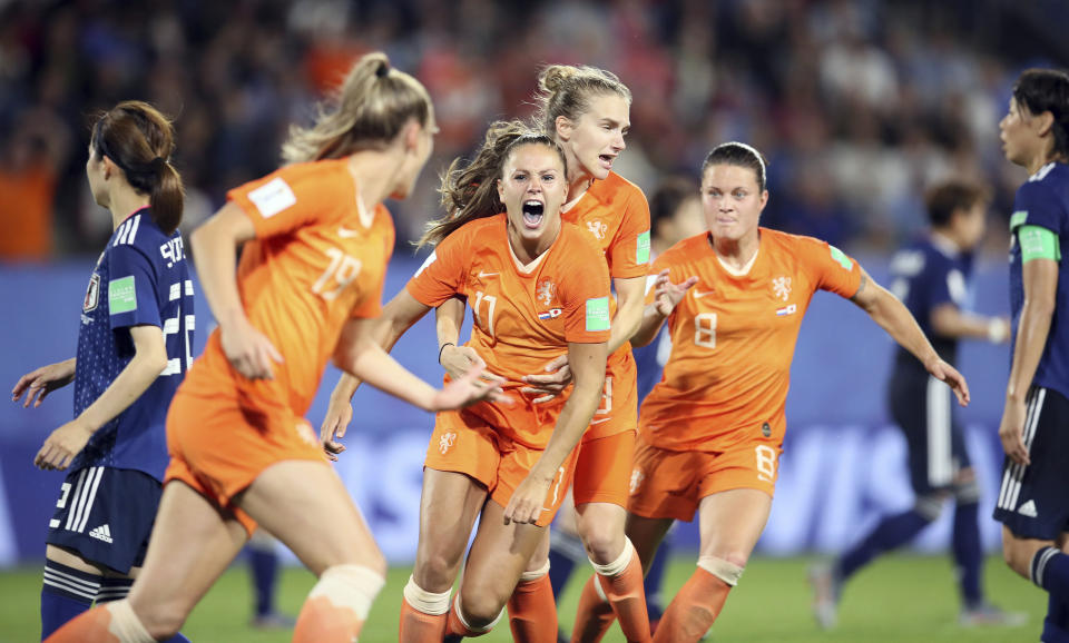 Netherlands' Lieke Martens, center, celebrates after scoring her side's second goal from the penalty spot during the Women's World Cup round of 16 soccer match between the Netherlands and Japan at the Roazhon Park, in Rennes, France, Tuesday, June 25, 2019. (AP Photo/David Vincent)