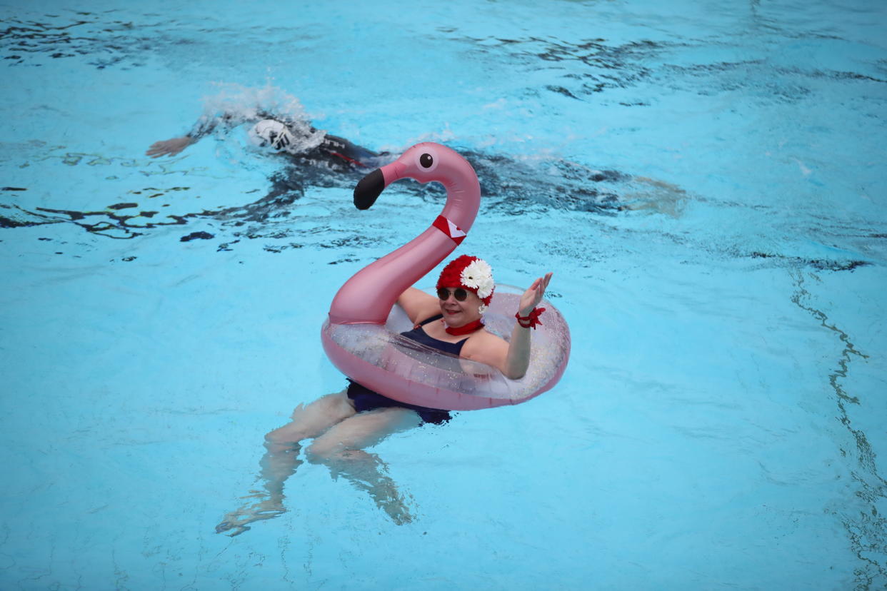 Nicole Foster swims in a rubber flamingo at Hillingdon Lido in Uxbridge, west London, on the first day of a major easing of England's coronavirus lockdown to allow far greater freedom outdoors. Picture date: Monday March 29, 2021.