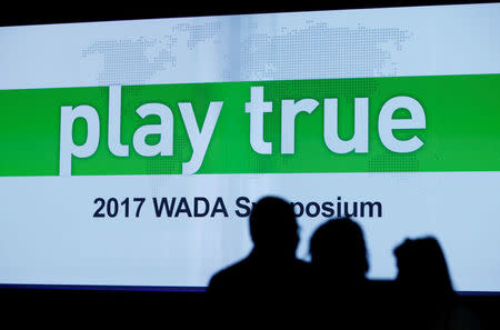 Attendees arrive at the Symposium of the World Anti Doping Agency (WADA) in Ecublens, Switzerland, March 13, 2017. REUTERS/Denis Balibouse