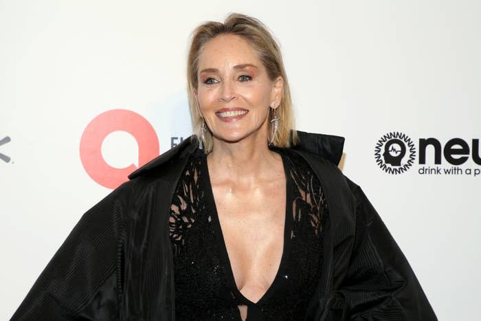 Sharon Stone smiles on the red carpet at annual Elton John AIDS Foundation Academy Awards viewing party.