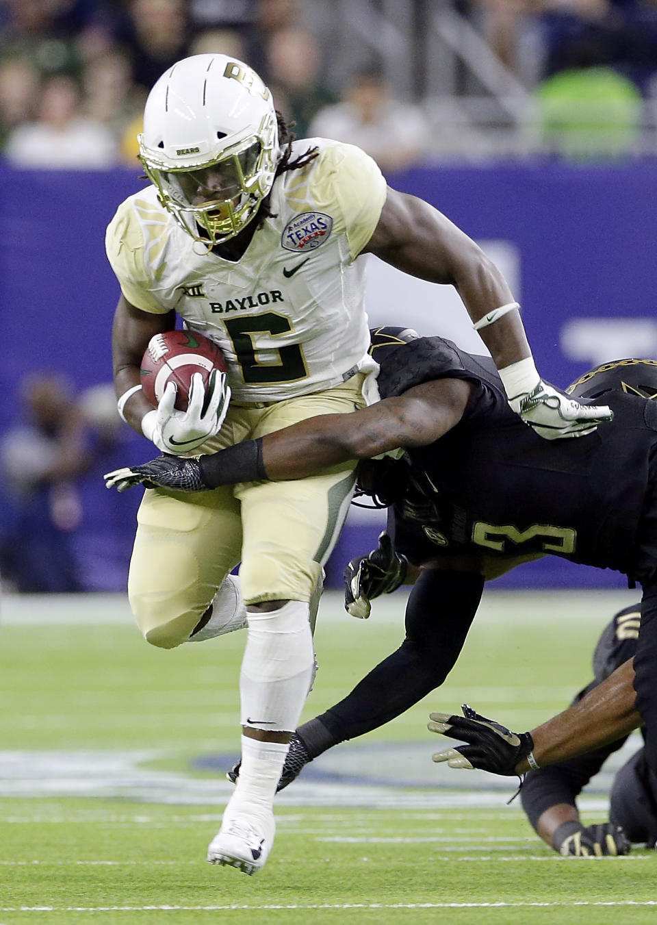 Baylor running back JaMycal Hasty (6) is tackled by Vanderbilt defensive back Tae Daley (3) during the first half of the Texas Bowl NCAA college football game Thursday, Dec. 27, 2018, in Houston. (AP Photo/Michael Wyke)