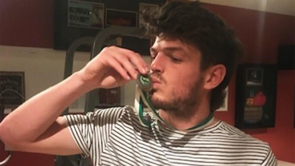 Angus Brayshaw kisses a medal as he takes a dig at the AFL. Pic: Instagram