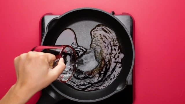 Pouring water into sauce in frying pan