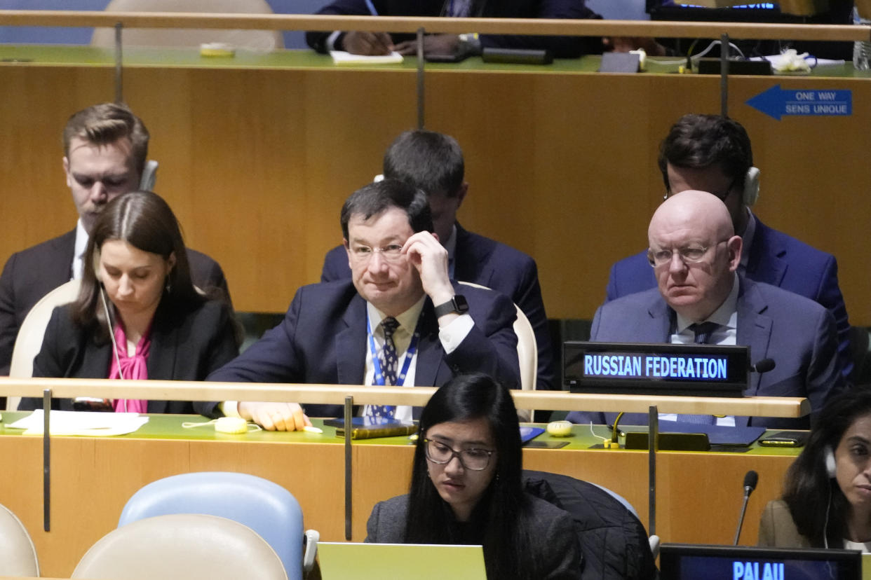 Russian Ambassador to the United Nations Vasily Nebenzya, right, listens as Ukrainian Foreign Minister Dmytro Kuleba addresses the 11th emergency special session of the General Assembly, Wednesday, Feb. 22, 2023 at United Nations headquarters. (AP Photo/Mary Altaffer)