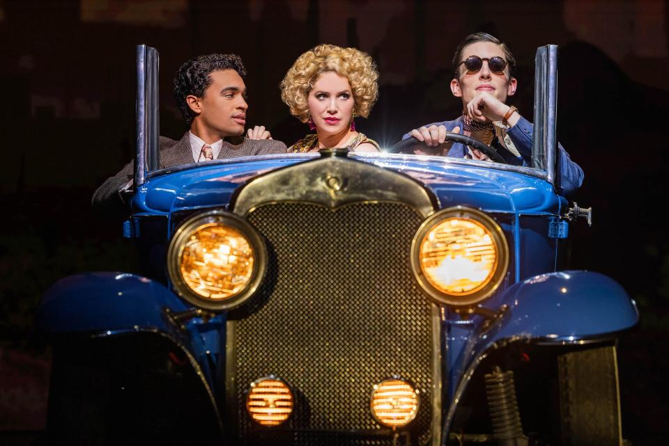 Noah J. Ricketts as Nick Carraway, Sara Chase as Myrtle Wilson and John Zdrojeski as Tom Buchanan in Paper Mill Playhouse's The Great Gatsby.