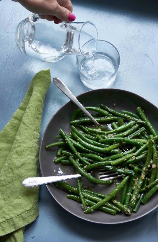 <p>Courtesy of Katie Workman</p><p>The dressing is bright and bracing and adds an extra layer of flavor to this simple green bean side dish.</p><p><strong>Get the Recipe: <a href="https://themom100.com/recipe/green-beans-with-tarragon-vinaigrette/" rel="nofollow noopener" target="_blank" data-ylk="slk:Green Beans with Tarragon Vinaigrette;elm:context_link;itc:0;sec:content-canvas" class="link rapid-noclick-resp">Green Beans with Tarragon Vinaigrette</a></strong></p>