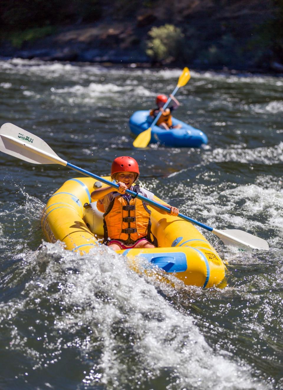 A one-person kayak, shown here on the Rogue River in Oregon, makes social distancing possible on a rafting trip.