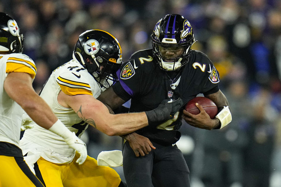 Pittsburgh Steelers linebacker Robert Spillane (41) tackles Baltimore Ravens quarterback Tyler Huntley (2) in the second half of an NFL football game in Baltimore, Fla., Sunday, Jan. 1, 2023. (AP Photo/Julio Cortez)