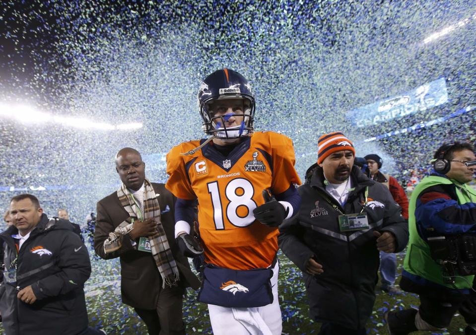 Denver Broncos quarterback Peyton Manning runs off the field after being defeated by the Seattle Seahawks in the NFL Super Bowl XLVIII football game in East Rutherford