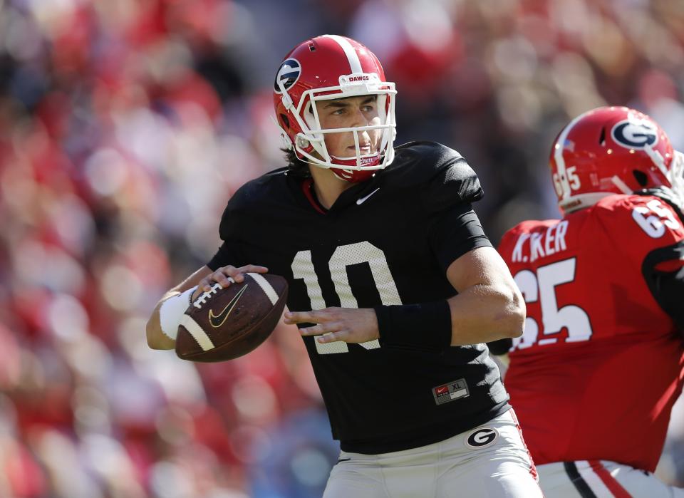 In this April 16, 2016, file photo, Georgia quarterback Jacob Eason throws during the first half of their spring intrasquad NCAA college football game in Athens, Ga. Freshman Jacob Eason, the biggest prize in Kirby Smart’s first recruiting class, should eventually take over at quarterback. (AP Photo/John Bazemore, File)