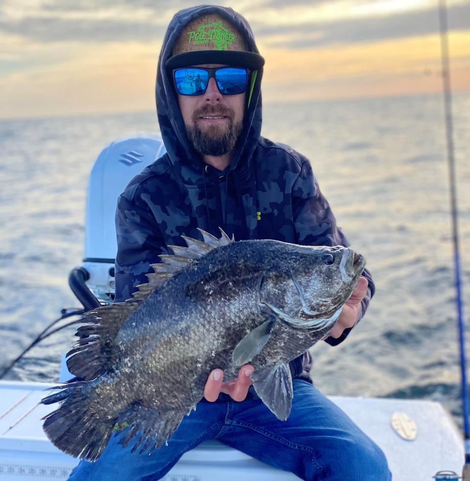 Capt. Jeff Patterson (Pole Dancer charter boat) with a weighty tripletail he found trying to hide.
