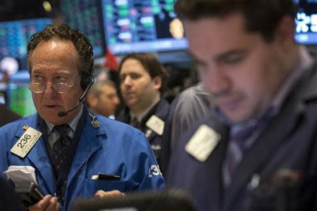 Traders work on the floor of the New York Stock Exchange March 17, 2014. REUTERS/Brendan McDermid