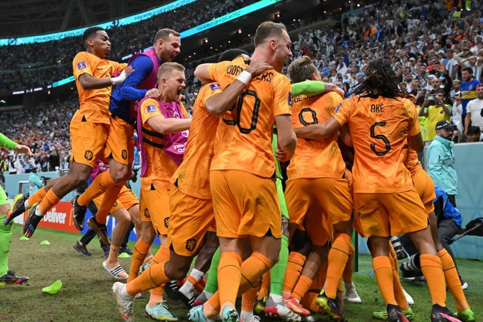 Netherlands’ forward Wout Weghorst celebrates with teammates (AFP via Getty Images)