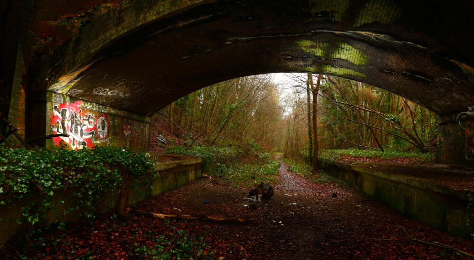 Graffiti painted under a bridge beside the footpath which follows the former track-bed of the Meon Valley Railway (MVR) at the site of the train station at West Meon in Hampshire.