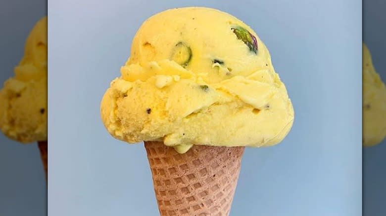 Woman holding saffron rosewater ice cream