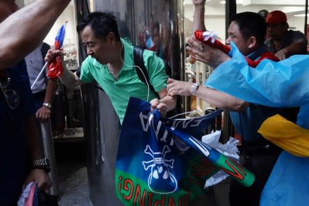 People engage in scuffles outside Grand Hyatt hotel, where Taiwan's President Tsai Ing-wen is supposed to stay during her visit to the U.S., in New York City