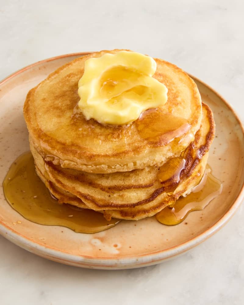 pancakes on a plate with butter and syrup