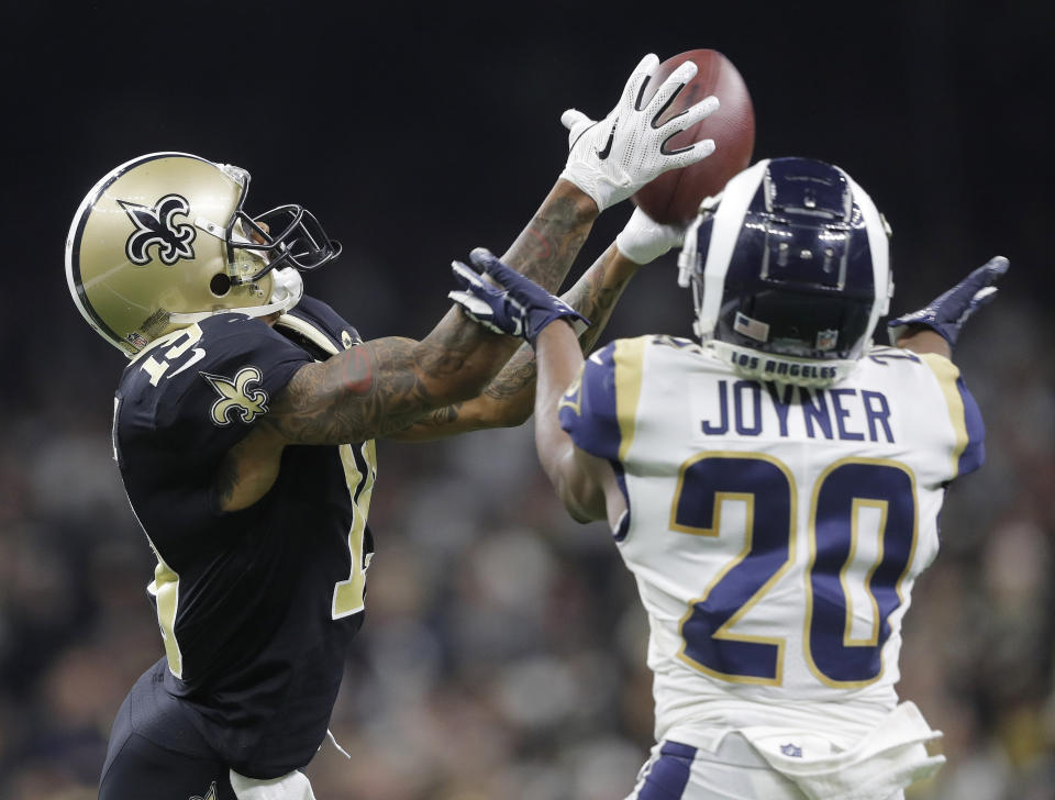 El wide receiver Ted Ginn (19), de los Saints de Nueva Orleáns, se queda con el balón ante el free safety Lamarcus Joyner, de los Rams de Los Ángeles, en el partido por el campeonato de la Conferencia Nacional de la NFL, el domingo 20 de enero de 2019, en Nueva Orleáns. (AP Foto/Gerald Herbert)