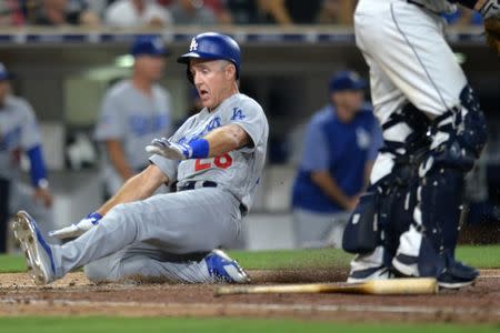 Jul 9, 2018; San Diego, CA, USA; Los Angeles Dodgers second baseman Chase Utley (26) slides in safely to score on a single by third baseman Justin Turner (not pictured) during the eighth inning at Petco Park. Mandatory Credit: Jake Roth-USA TODAY Sports