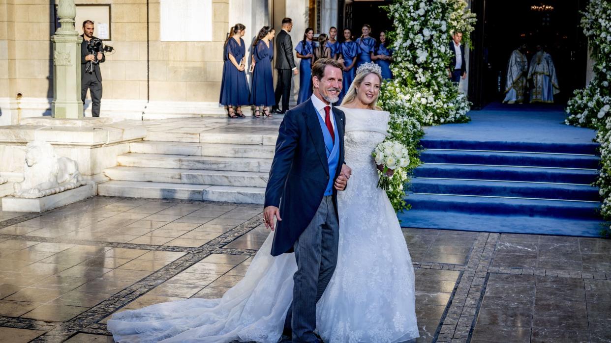 Princess Theodora in wedding dress beside Crown Prince Pavlos