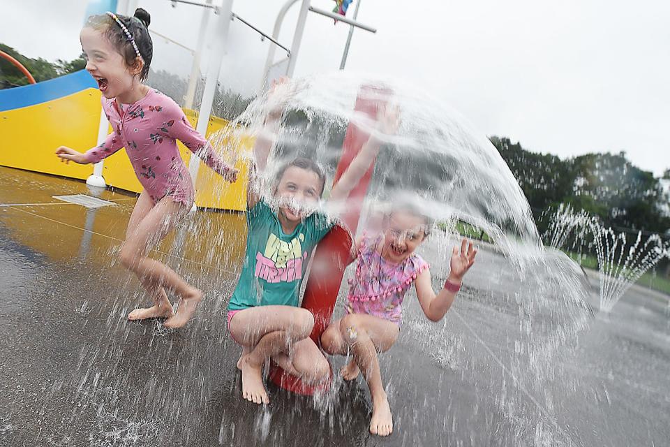 In this 2023 file photo, triplets Lydia, Claire and Simone O. play at the splash pad at the Stoico/FIRSTFED YMCA in Swansea.