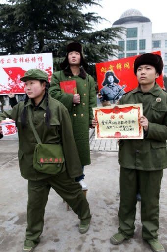 This photo taken on March 3, shows a group of college students dressed up like Lei Feng as they stage a performance in Hanshan, east China's Anhui province as part of a huge public campaign to commemorate the 50th anniversary of Lei Feng's death. To the Chinese government, Lei Feng, who died 50 years ago this month, is a hero whose selfless deeds make him an ideal role model