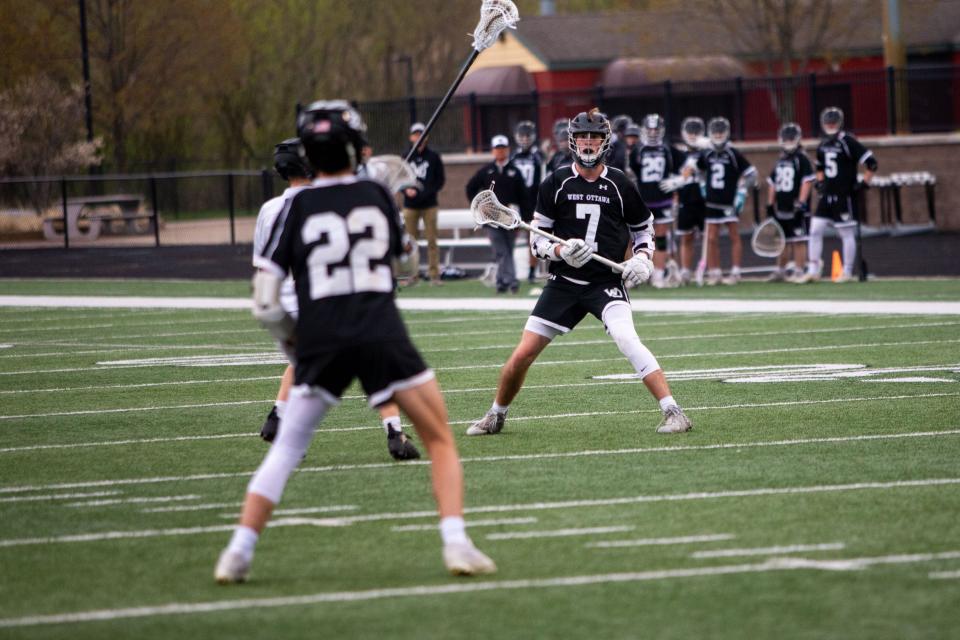 West Ottawa's Trent Mulder looks to recieve a pass Thursday, May 5, 2022, at Zeeland High School. 