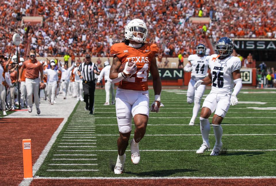 Texas running back Jonathon Brooks scores the Longhorns' first touchdown of the season on a 37-yard screen pass from Quinn Ewers during the first quarter of Saturday's season opener against Rice at Royal-Memorial Stadium.