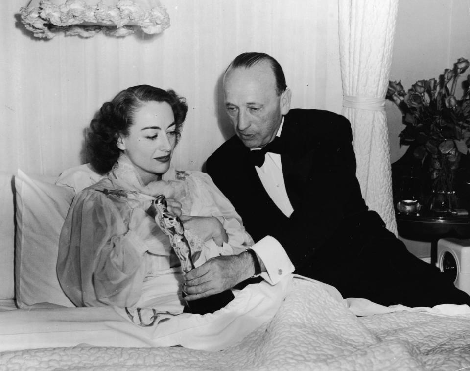 1946: Accepting her Academy Award in bed