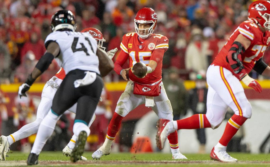 Kansas City Chiefs quarterback Patrick Mahomes (15) hands the ball off during an NFL divisional round playoff game against the Jacksonville Jaguars at GEHA Field at Arrowhead Stadium on Saturday, Jan. 21, 2023, in Kansas City.