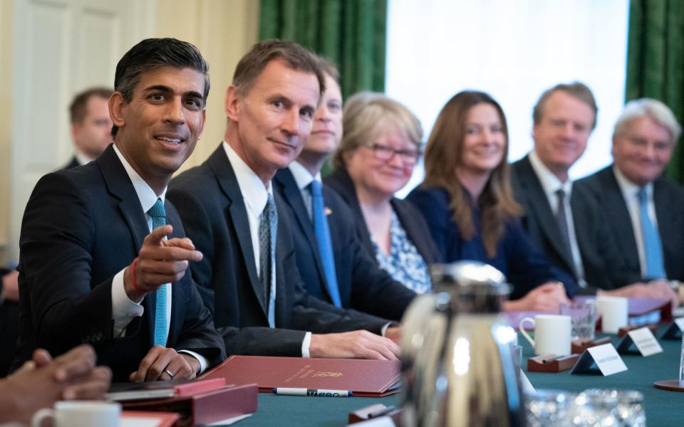 Prime Minister Rishi Sunak (left), alongside the Chancellor of the Exchequer, Jeremy Hunt (second left) - Stefan Rousseau/PA Wire