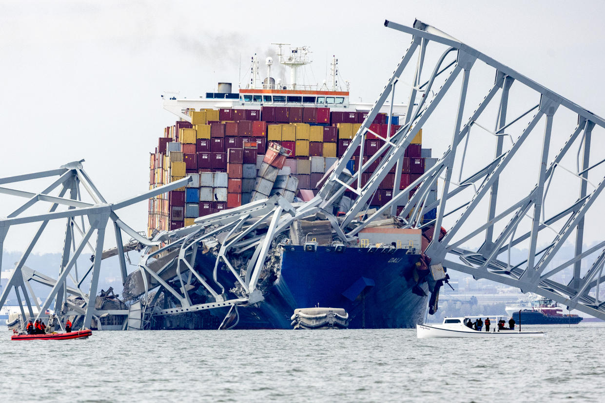 The cargo ship Dali sits in the water amid the wreckage following the collapse of the Francis Scott Key Bridge in Baltimore.