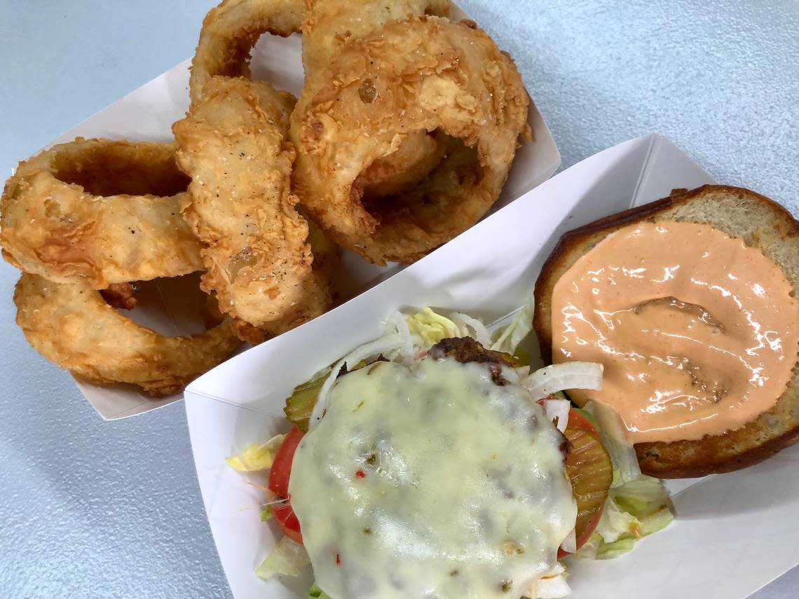 The Ten Pepper Burger with onion rings at The Original Chop House Burgers in Arlington. Bud Kennedy/bud@star-telegram.com