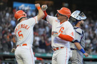 San Francisco Giants' Joc Pederson, right, is congratulated by Mike Yastrzemski (5) as he crosses home plate after hitting a two-run home run against the New York Mets during the third inning of a baseball game in San Francisco, Tuesday, May 24, 2022. (AP Photo/Tony Avelar)