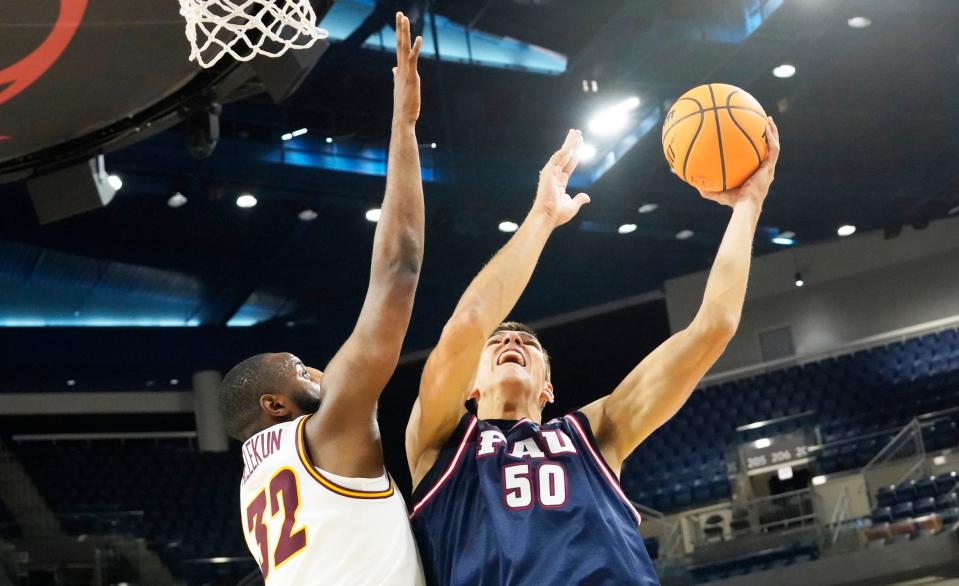 Nov 8, 2023; Chicago, Illinois, USA; Loyola defends Florida Atlantic Owls center Vladislav Goldin (50) Ramblers forward Dame Adelekun (32) during the second half at Wintrust Arena. Mandatory Credit: David Banks-USA TODAY Sports