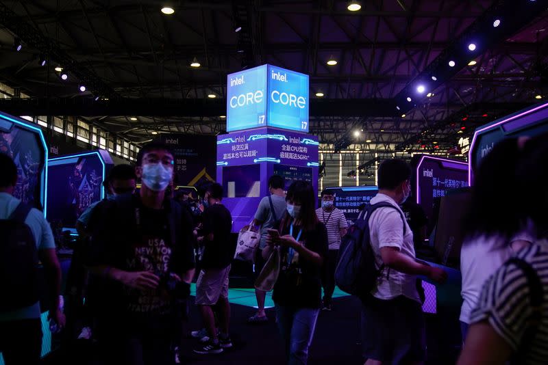 Visitors are seen at the Intel booth during the China Digital Entertainment Expo and Conference, also known as ChinaJoy, in Shanghai