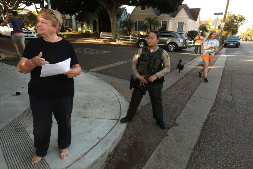 SANTA MONICA, CA - SEPTEMBER 14, 2022 - - Los Angeles Supervisor Shelia Kuehl talks to the media after Los Angeles County sheriffs served her with an early morning search warrant, which she is holding, in Santa Monica on September 14, 2022. This was part of a criminal investigation into a county contract awarded to a nonprofit organization. Sheriff's investigators also searched Patti Giggans' house, her nonprofit's offices, officers at the L.A. County Hall of Administration and the headquarters of the county's Metropolitan Transportation Authority, which awarded a contract to Giggans' Peace Over Violence." (Genaro Molina / Los Angeles Times)