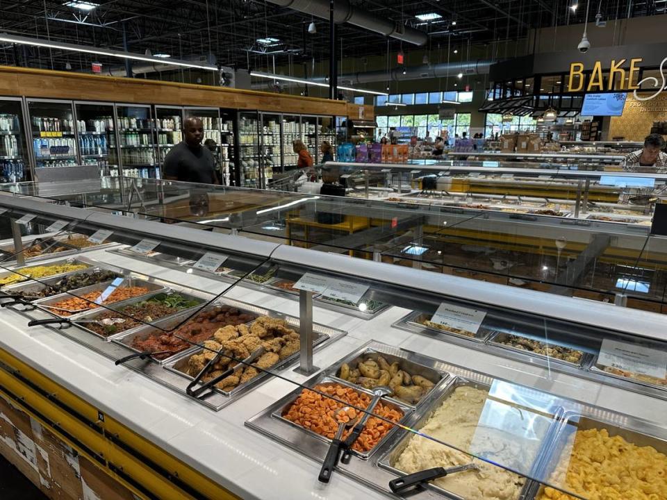 Whole Foods Market’s hot food bar in the foreground at its Pinecrest location on Dec. 7, 2023. Scott Bova, Whole Foods’ vice president of culinary, said the bars bring in seasonal selections.
