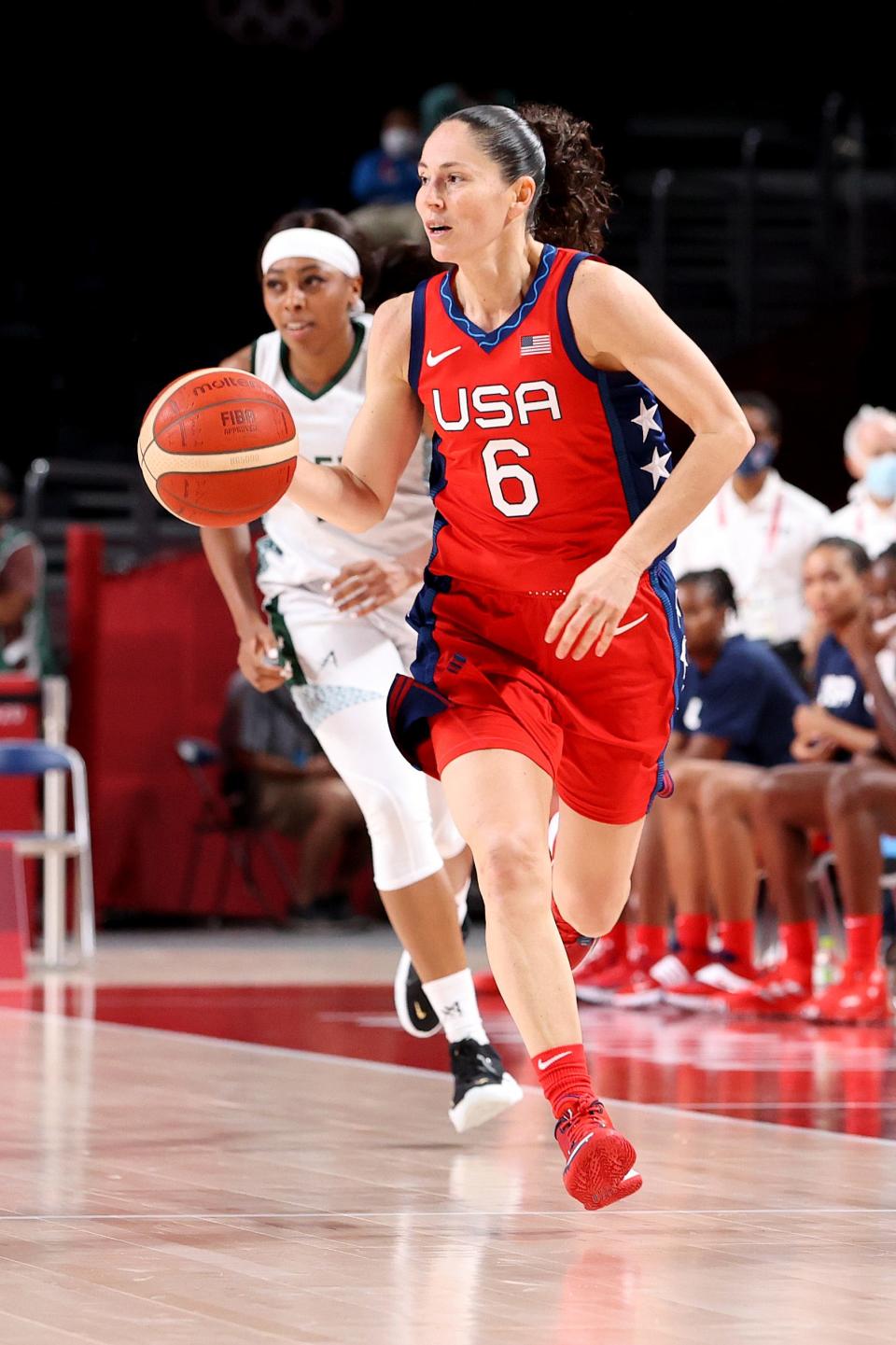 Sue Bird dribbles up the floor.